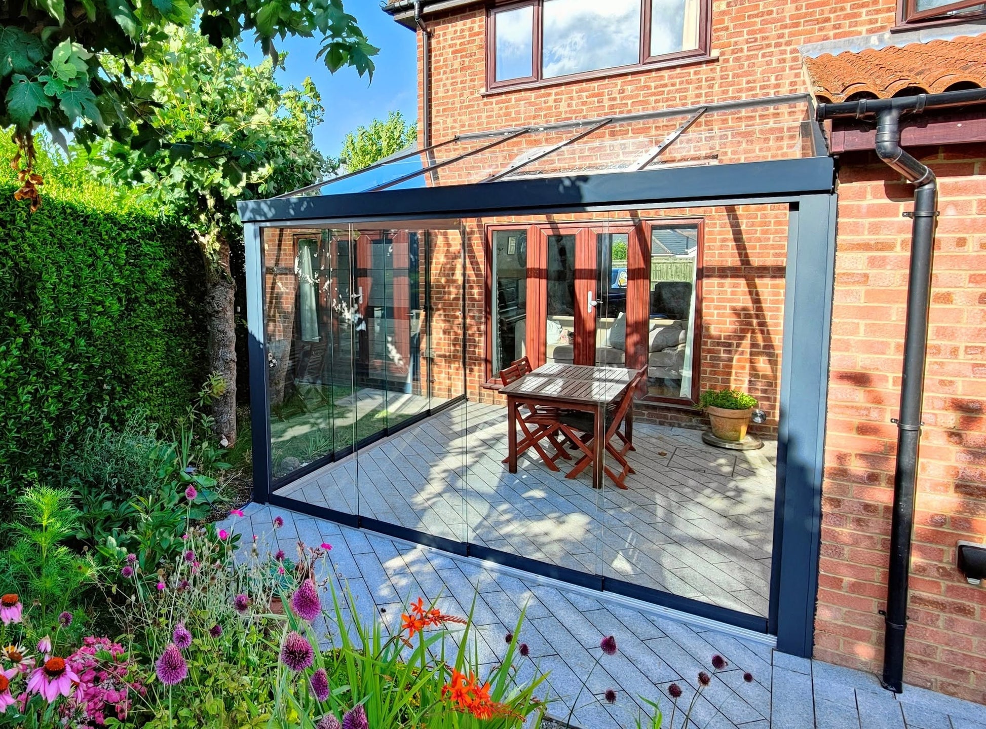 Lean - to wall glassroom